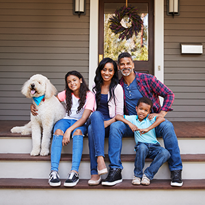 FAMILY WITH DOG ON PORCH